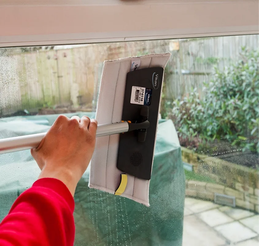 Window being cleaned with a squeegee